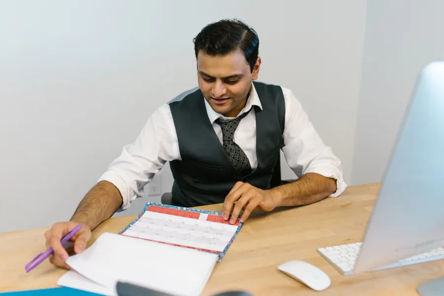 Checking a calendar and schedule while planning a Melbourne trade show visit
